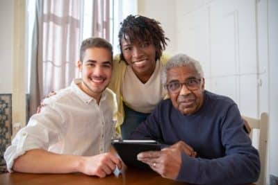 Woman volunteer with elderly man