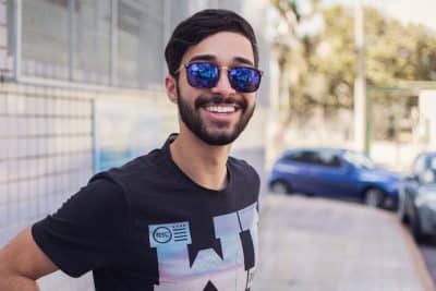 Man with glasses smiling