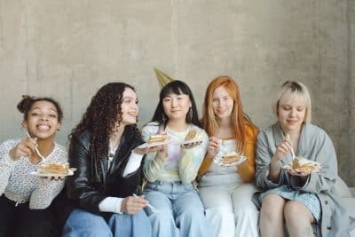Women friends with cake